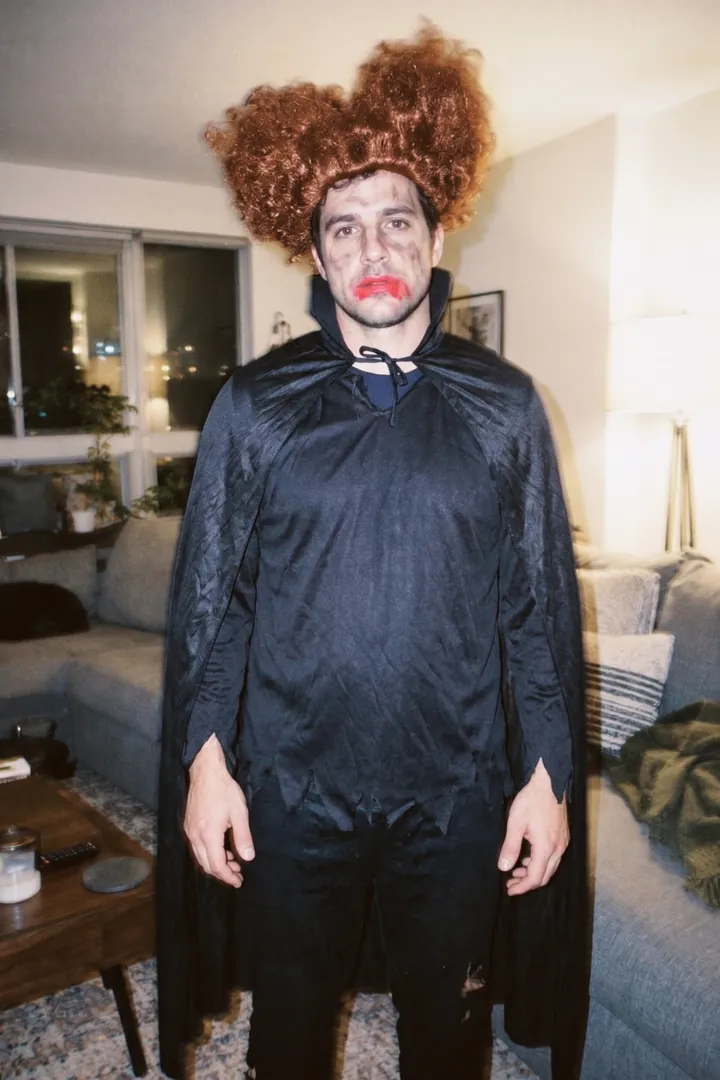 The truth: a frizzy wig, smeared lipstick and a cheap cape, flash photo