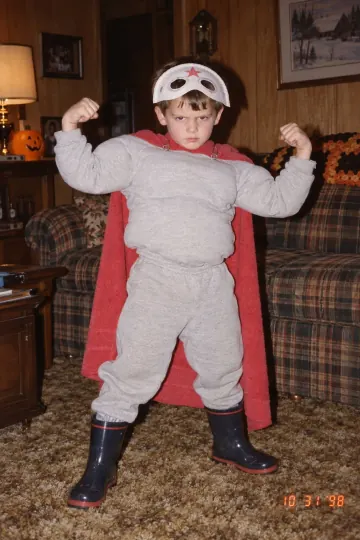 The real childhood Halloween costume: a sweatsuit, pillow muscles and a cape